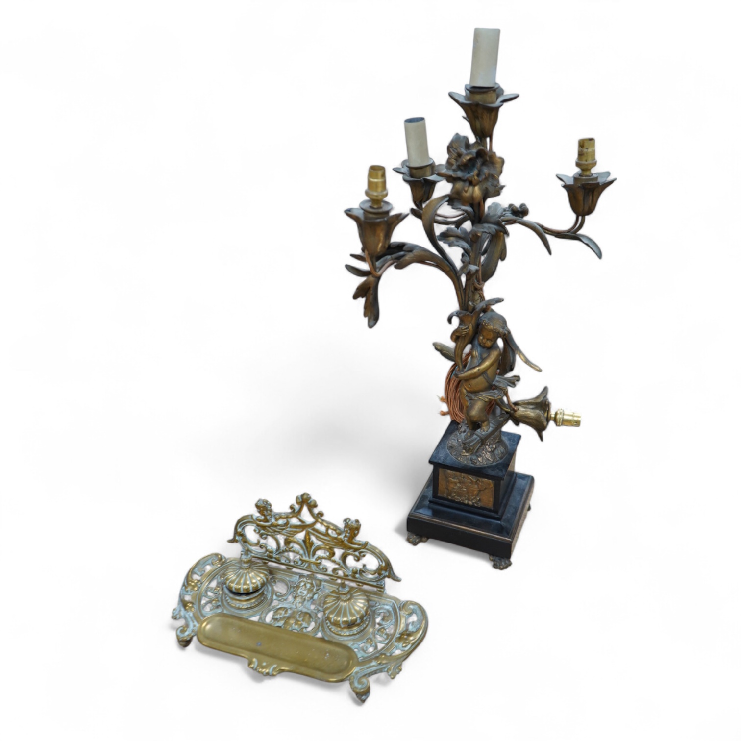 An early 20th century ormolu and marble ‘cherub’ converted candelabra and a brass desk stand, tallest 56cm